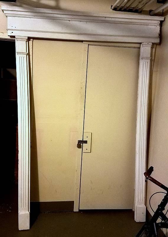 White door facade approximately 69 in wide x 94 h, made of foam or composite