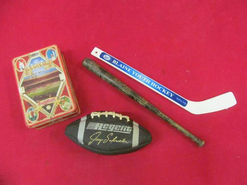 lot 20 image: tin,bat,hockey stick, football