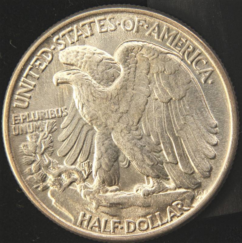 lot 61 image: 1945 WALKING LIBERTY SILVER HALF DOLLAR AU58 looks UNC in hand