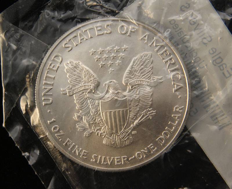 lot 64 image: 2007 AMERICAN SILVER EAGLE 1 TROY OZ. .999 FINE SILVER LITTLETON SEALED