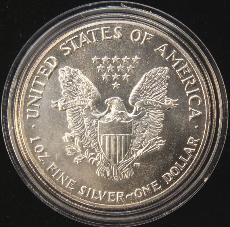 lot 73 image: 1987 AMERICAN SILVER EAGLE 1 TROY OZ. .999 FINE SILVER IN AIRTITE