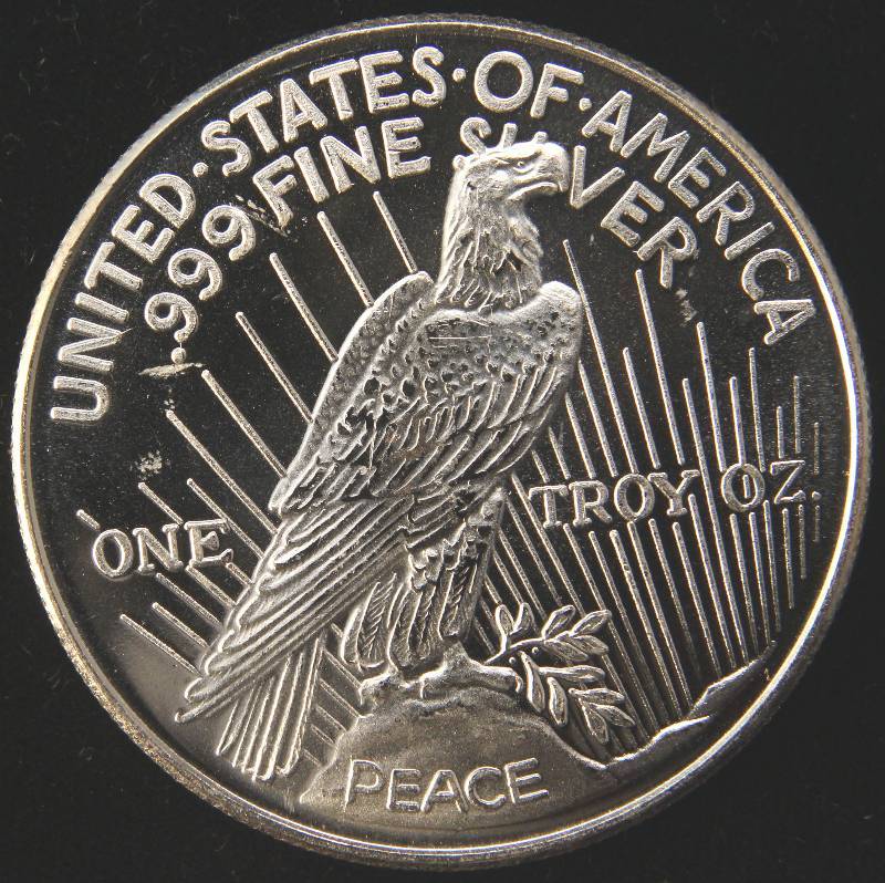 lot 100 image: 1 TROY OZ. .999 FINE SILVER PEACE DOLLAR DESIGN