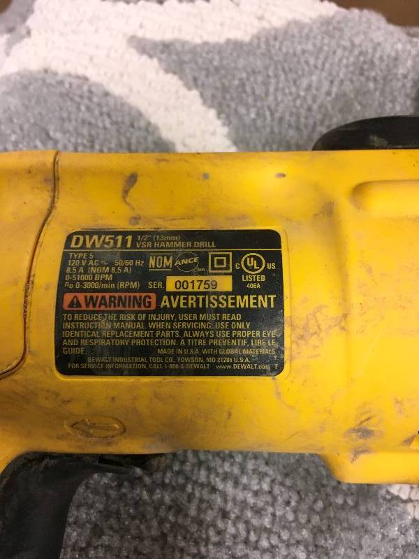 DeWalt 12 in. Variable Speed Reversible Hammer Drill in working conditions