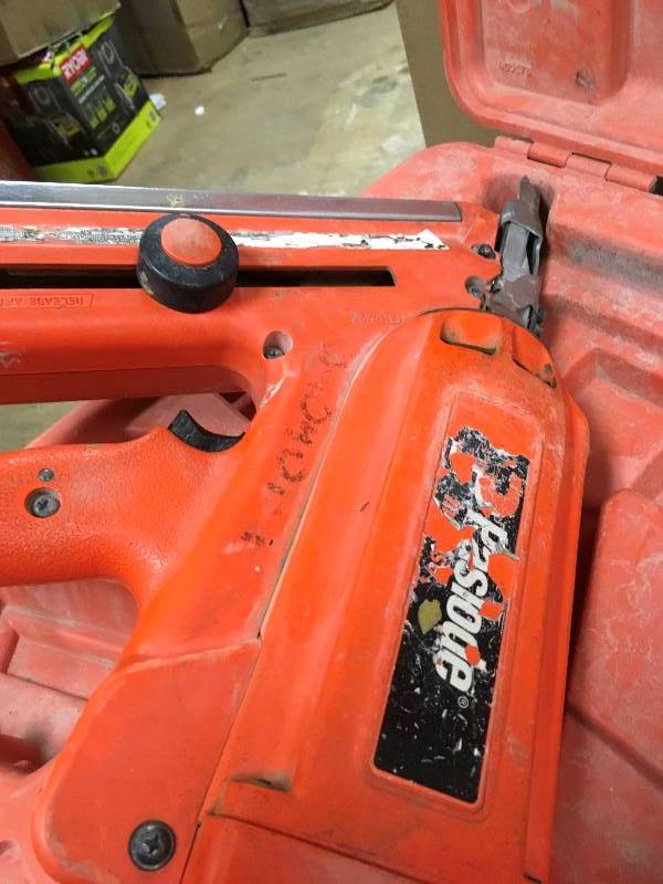 Paslode Cordless Nailer with Internal Combustion Motor in working conditions