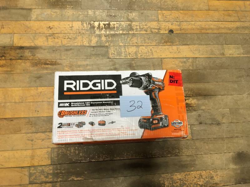 lot 32 image: Ridgid 18 Volt Brushless Hammer Drill open box not used