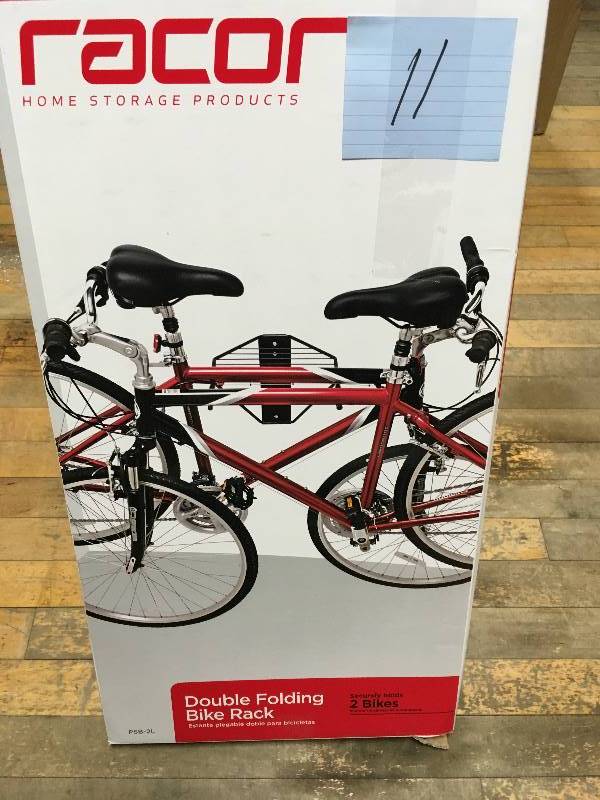 lot 11 image: Racor ProStor Wall Folding Bike Rack  open box not used