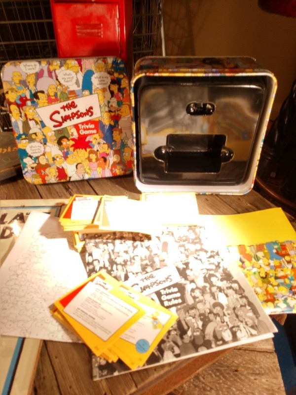 lot 34 image: Smoking Is Permitted In This Section Sign, Chocolate Dipped Ice Cream Sign, Red Locker, The Simpsons Trivia Game Tin Container and Contents