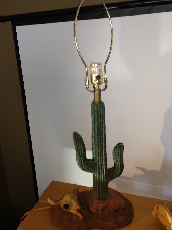 lot 90 image: Cactus Base Lamp, Wagon Base Lamp, Handmade Ship Lamp-Made in Holland, and Wolf Base Lamp 