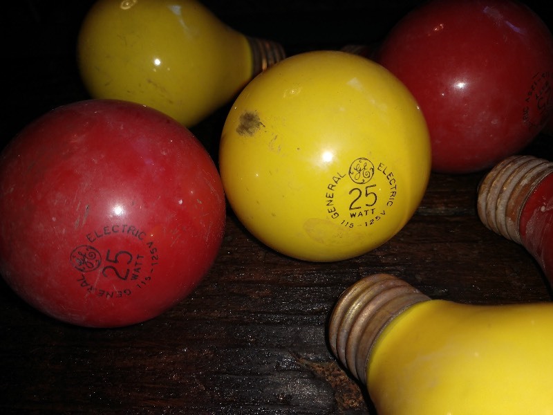 lot 92 image: Vintage Red and Yellow Colored Lightbulbs and Antique Flashlight 