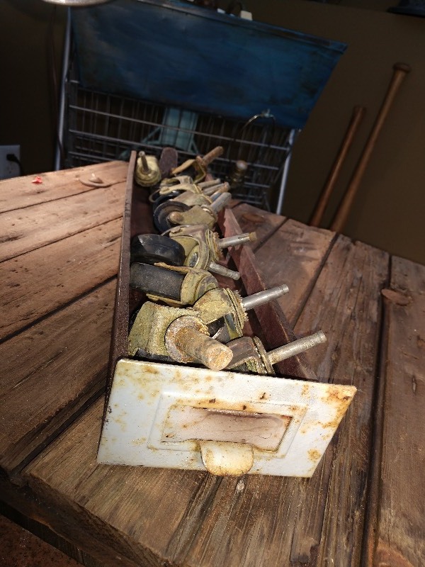 lot 123 image: Industrial Parts Bin and Brass Casters (12)