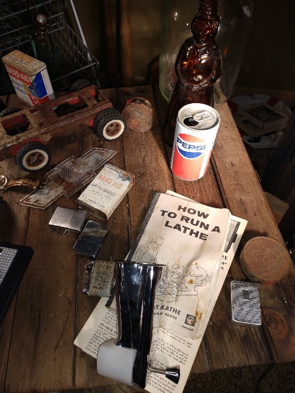 lot 133 image: A&W Jug, Aunt Jemima Container, Manual Pump for John Deere Tractor, Tin Band Aid Container, Avon Bottle, Car, Pepsi Can, Zippos