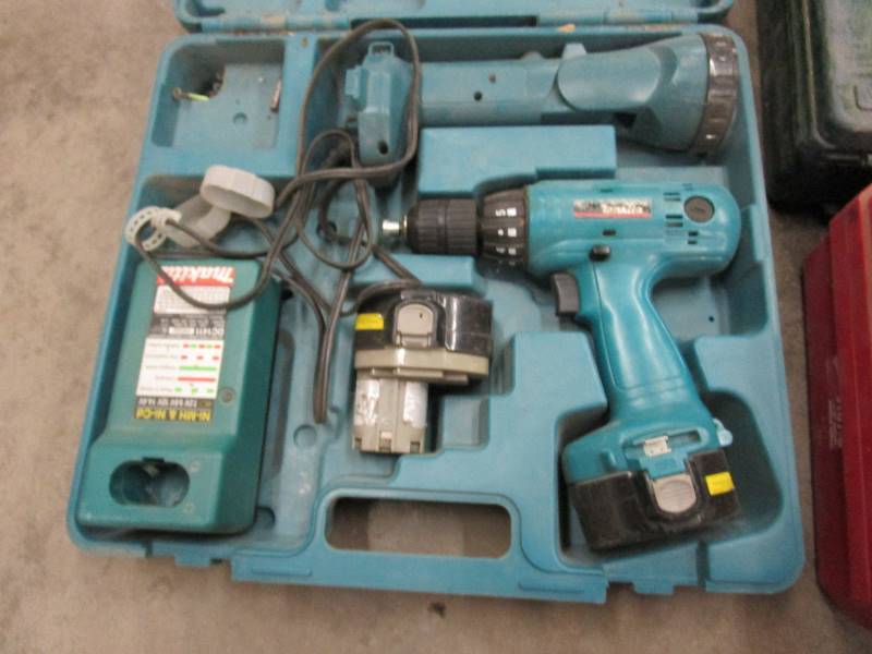 lot 42 image: Makita 14.4 Drill, Light & Empty Tool Cases