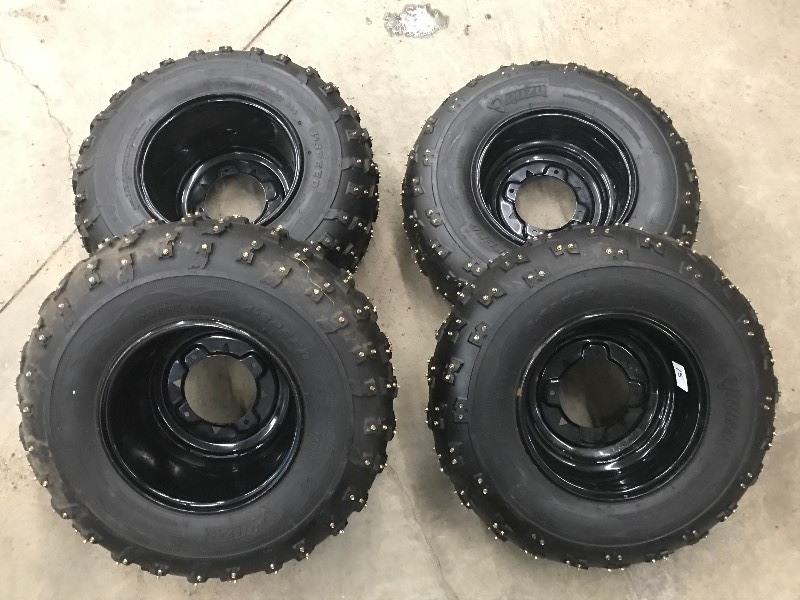 lot 15 image: Set Of (4) Polaris Studded Wheels &...