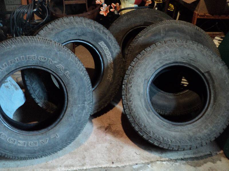5 tires- 3 are uniroyal laredo and ...