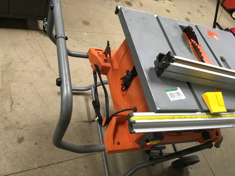Ridgid 15 Amp 10 in. Heavy-Duty Portable Table Saw with Stand used plastic that holds the guide is damaged saw  in working condition
