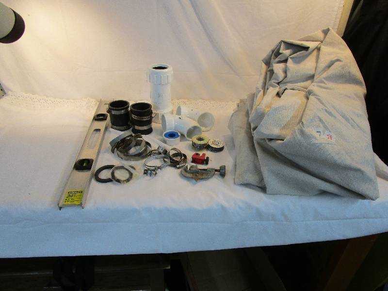 lot 58 image: Painters Tarp, Plumbing Stuff 2 ft Level, 2 pipe cutters, Teflon Tape,  and lots of clamps