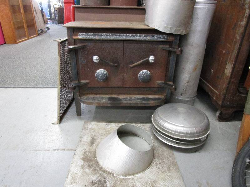 lot 88 image: Frontier Cast Iron StoveWoodburning Stove very Heavy please bring your own help