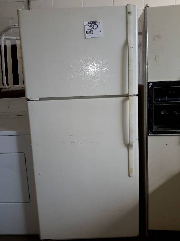 lot 30 image: GE UpperLower Refrigerator Freezer