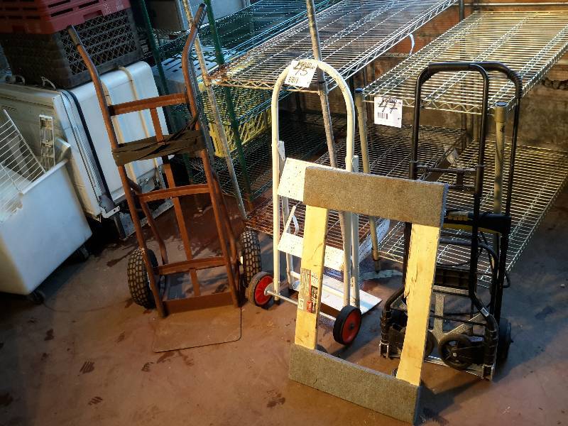 lot 45 image: Misc. Two Wheel Carts as pictured.  1, flat bed dolly.. Couple folding carts