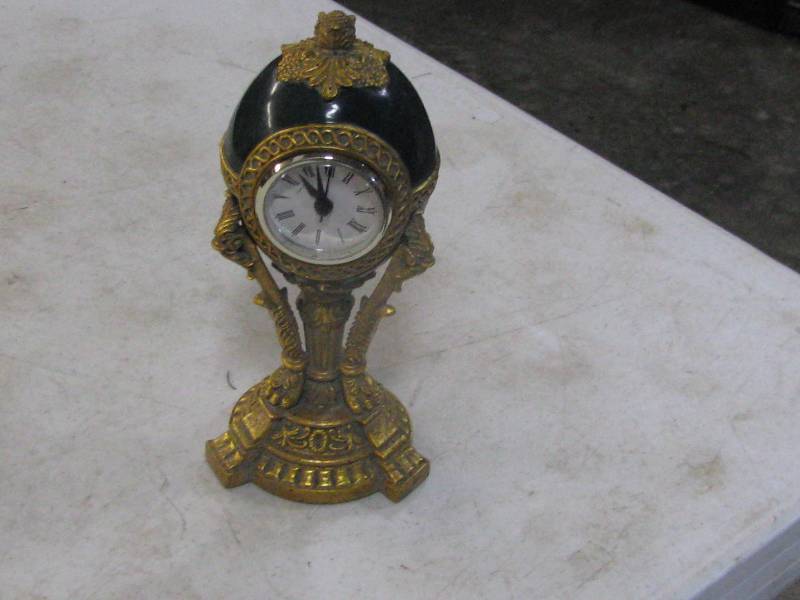 lot 27 image: Eye Ball clock