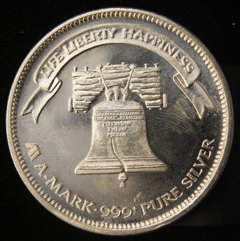 lot 25 image: 1 TROY OZ. .999 FINE SILVER 1984 A-MARK LIBERTY ROUND
