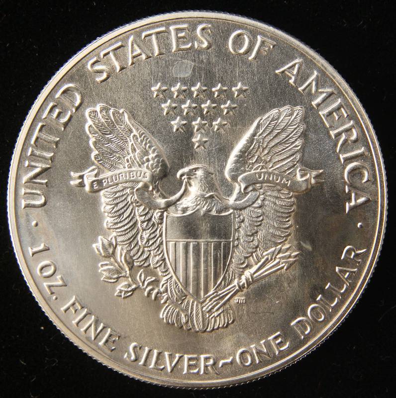 lot 35 image: 1987 AMERICAN SILVER EAGLE 1 TROY OZ. .999 FINE SILVER