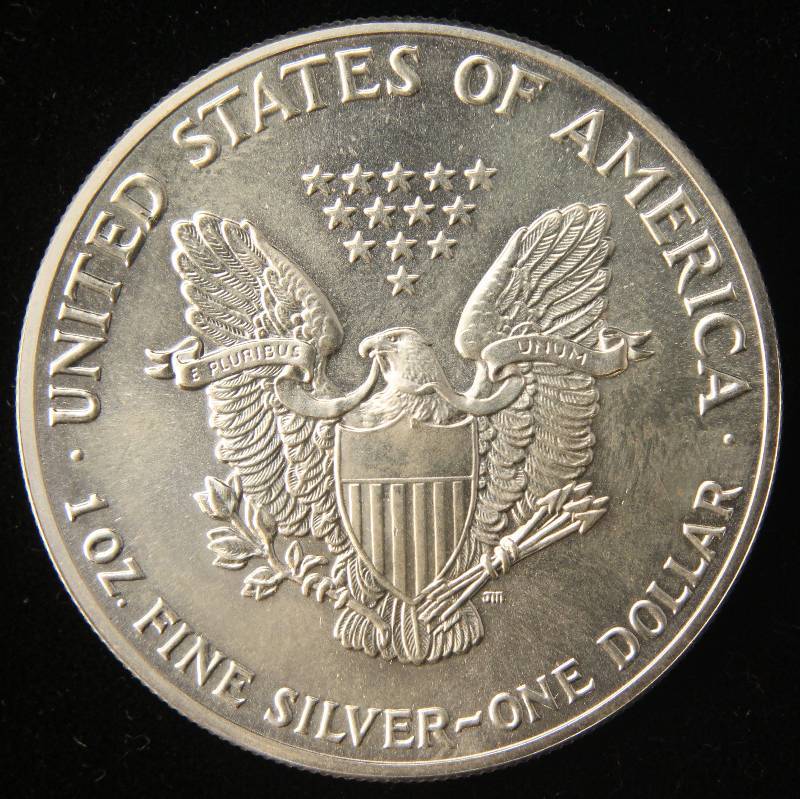 lot 36 image: 1989 AMERICAN SILVER EAGLE 1 TROY OZ. .999 FINE SILVER