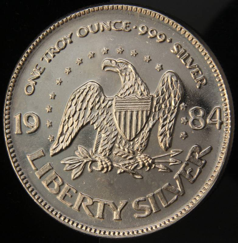 lot 85 image: 1 TROY OZ. .999 FINE SILVER 1984 A-MARK LIBERTY ROUND
