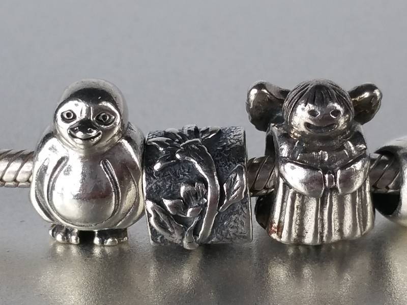 $1000 Retail.  Amazing Silver Pandora Charm Bracelet with 15 sterling silver charms.  Some retired and rare.