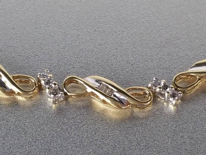 $1500 Retail.  Ladies Diamond Bracelet in Yellow 10k Gold