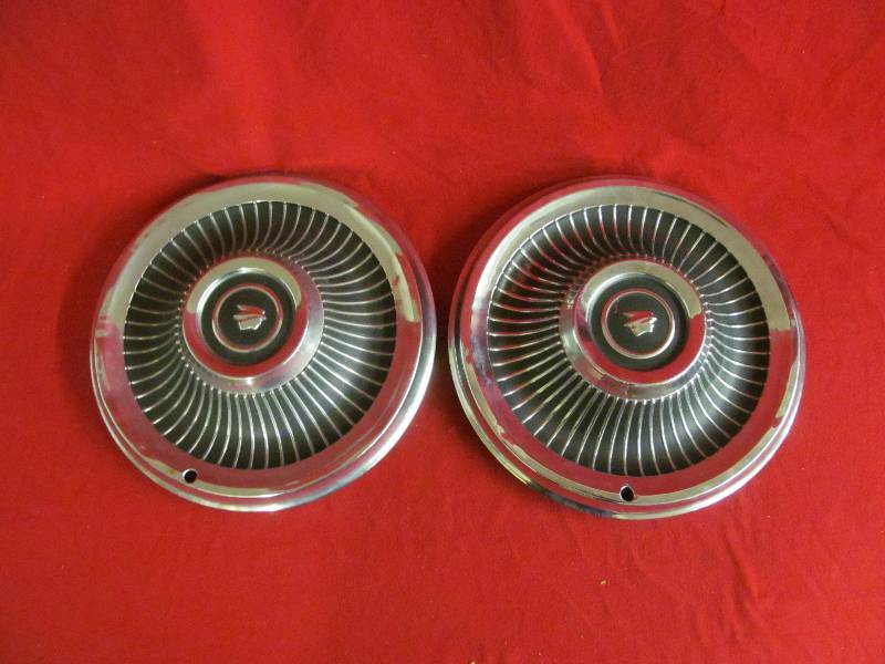vintage Plymouth hubcaps