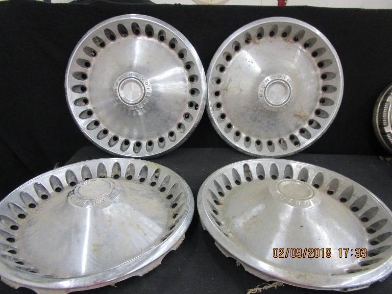 lot 114 image: 4-Plymouth Division Hub Caps