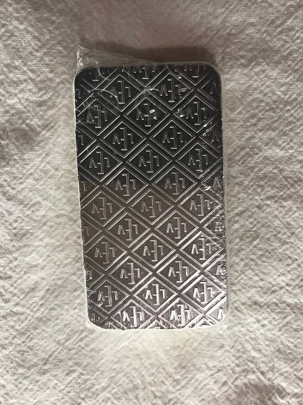 lot 97 image: GEIGER SECURITY LINE SILVER BAR 10 OZ .999