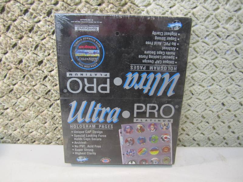 lot 103 image: Ultra Pro Platinum Pog Holder Pages...