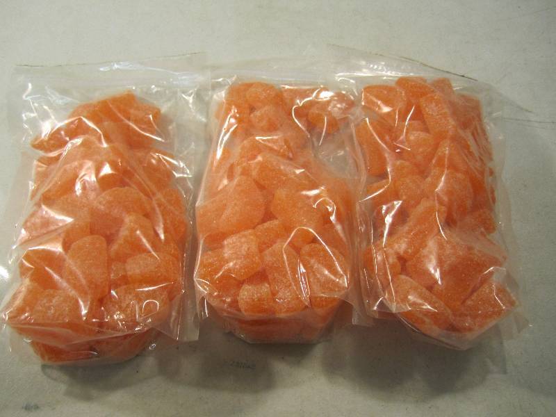 lot 247 image: 3 Pounds of Orange Slice Candy 3 - ...