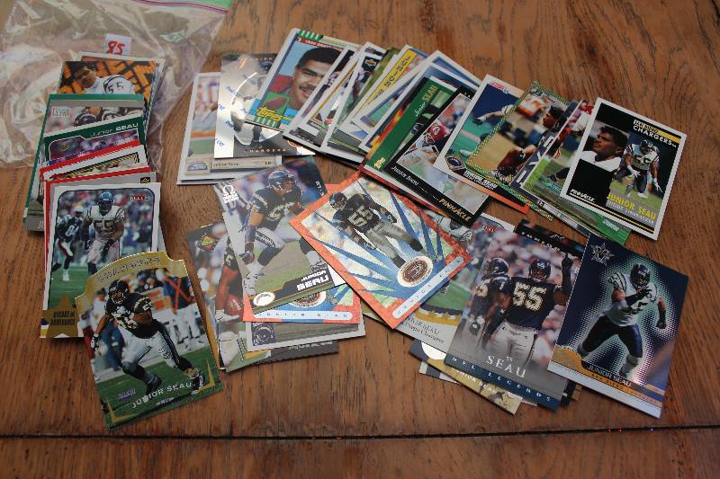 lot 85 image: 100 Junior Seau Cards...