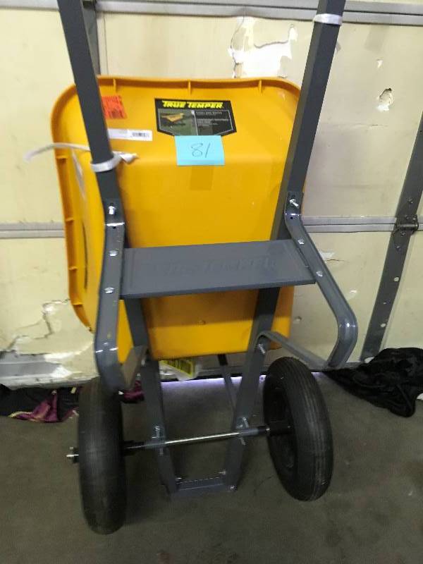 lot 81 image: True Temper 6 CU. Ft. Poly Wheelbarrow open box not used