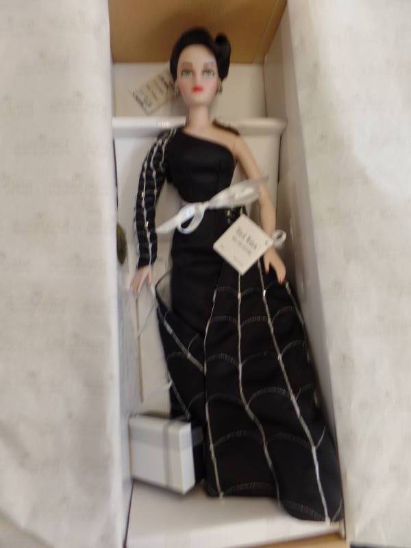 lot 334 image: MEL ODOMS MADRA DOLL WITH COSTUME
