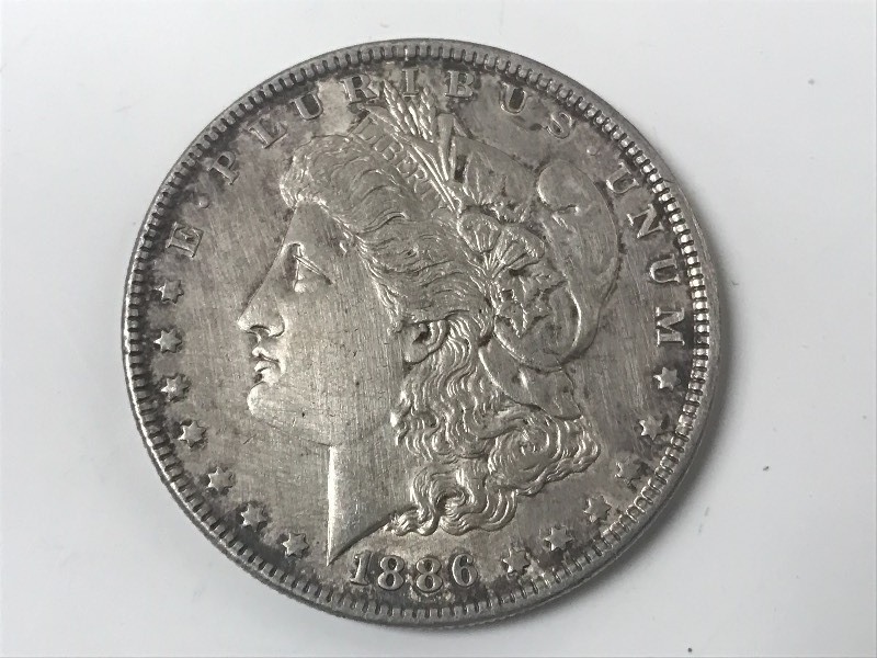 lot 24 image: 1886 Morgan Silver Dollar ...