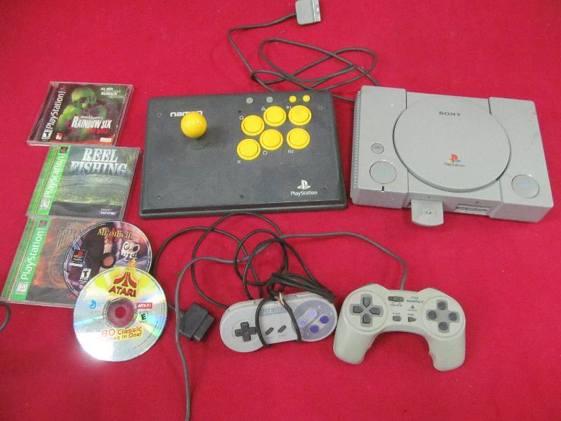 lot 58 image: Play station games, PlayStation Namco Joy Stick, Sony PlayStation console