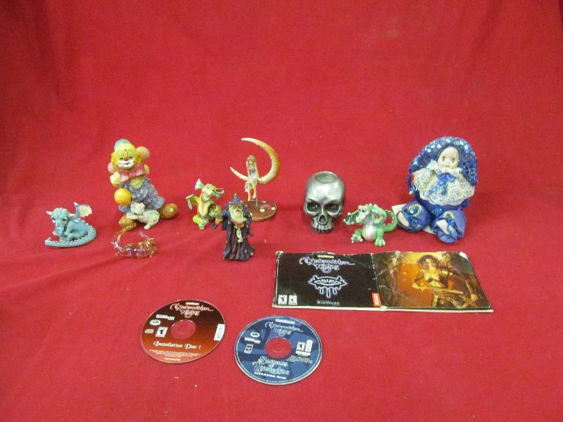 lot 89 image: wizard, dragon figurines Atari discs