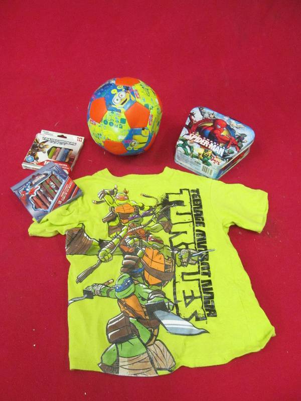lot 114 image: Minion soccer ball, Ninja Turtle shirt, crayons