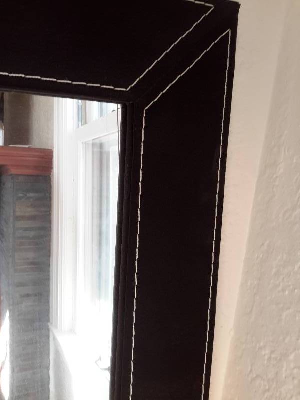 Nicely Framed Mirror in Suede Frame.. Black.