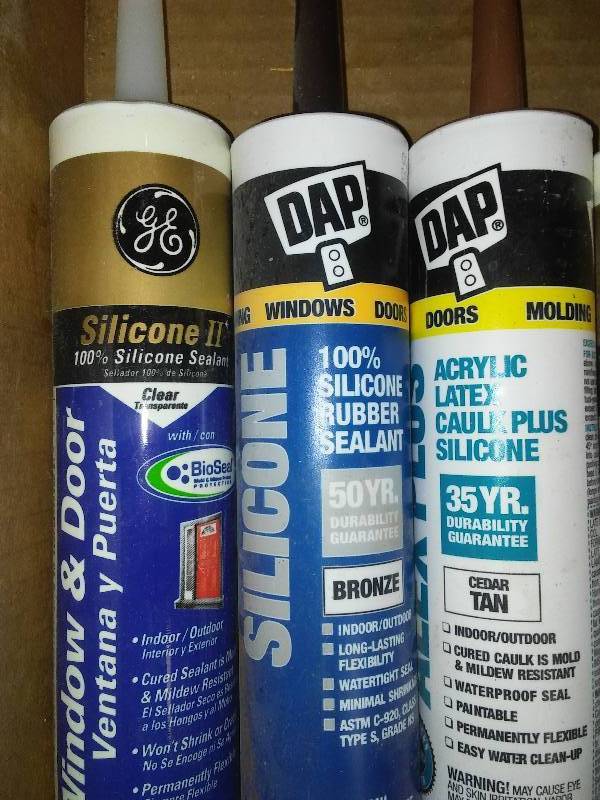 8 new tubes of caulk  Caulk gun and Wood putty.