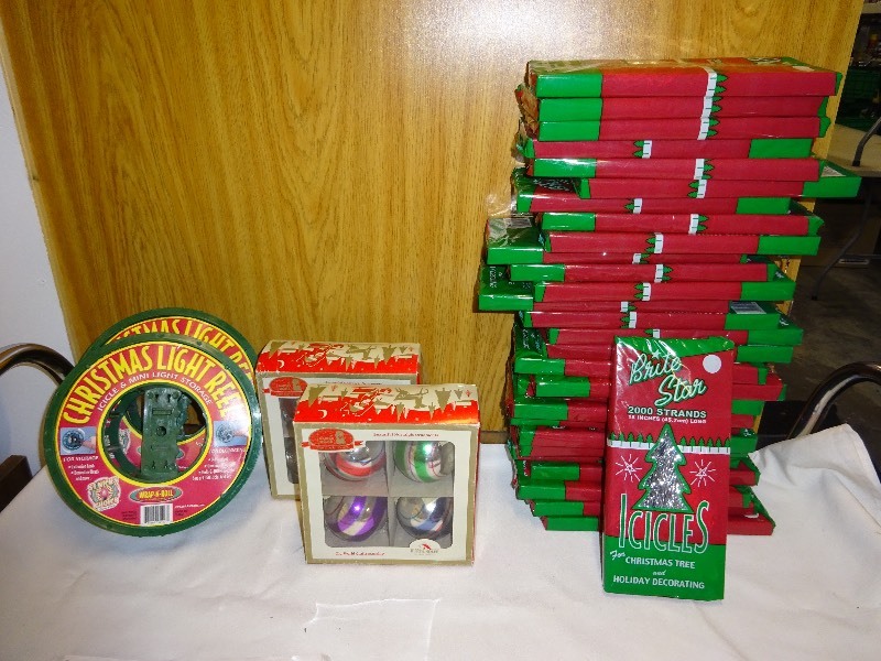 2 Christmas light reels 2 boxes ornaments 1 bulb broken