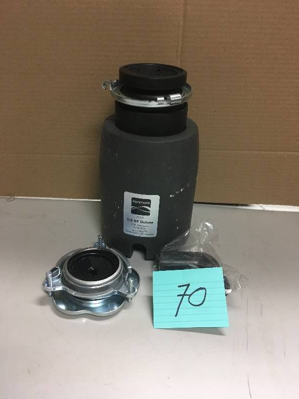 lot 70 image: Kenmore 70321 12 HP Deluxe Garbage Disposer- Dark Gray used in working condition