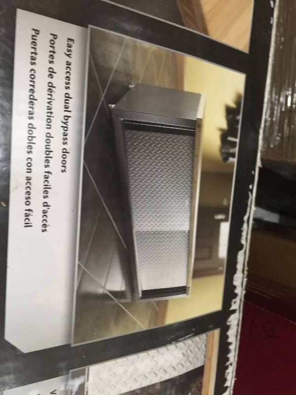 Gladiator Ready to Assemble 19 in. H x 54 in. W x 18 in. D Steel Garage Storage Bench with Bamboo Top & Silver Tread Plate doors open box never used