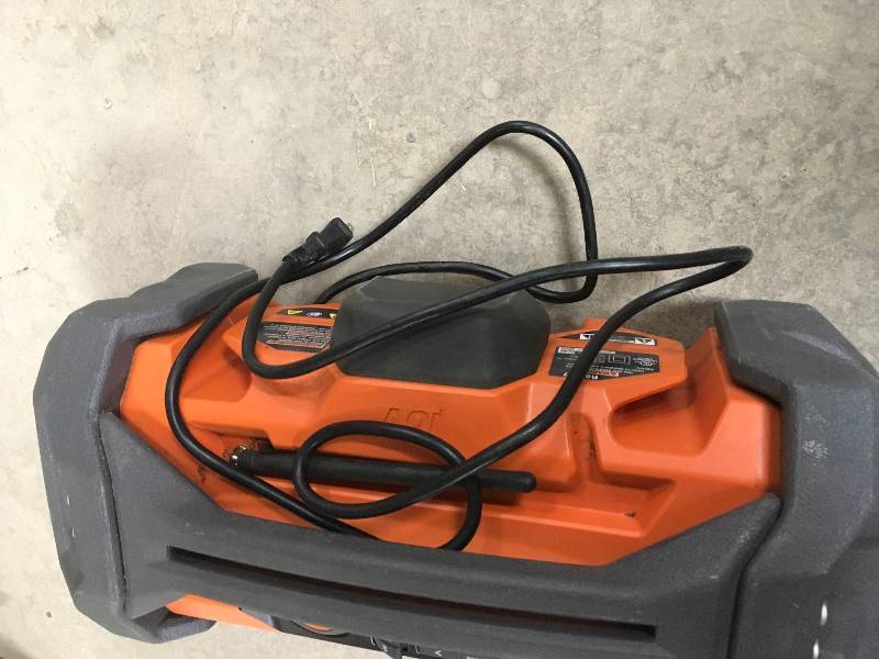 RIDGID GEN5X 18-Volt Jobsite Radio with Bluetooth Wireless Technology in working conditions plastic cover are rip