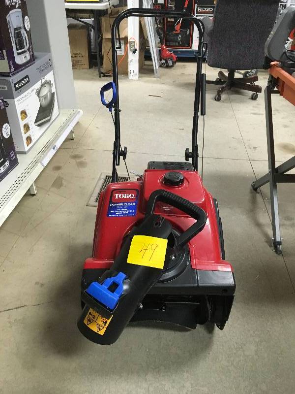 Toro Power Clear 518 ZR 18 in. 99cc Single-Stage Gas Snow Blower in working conditions