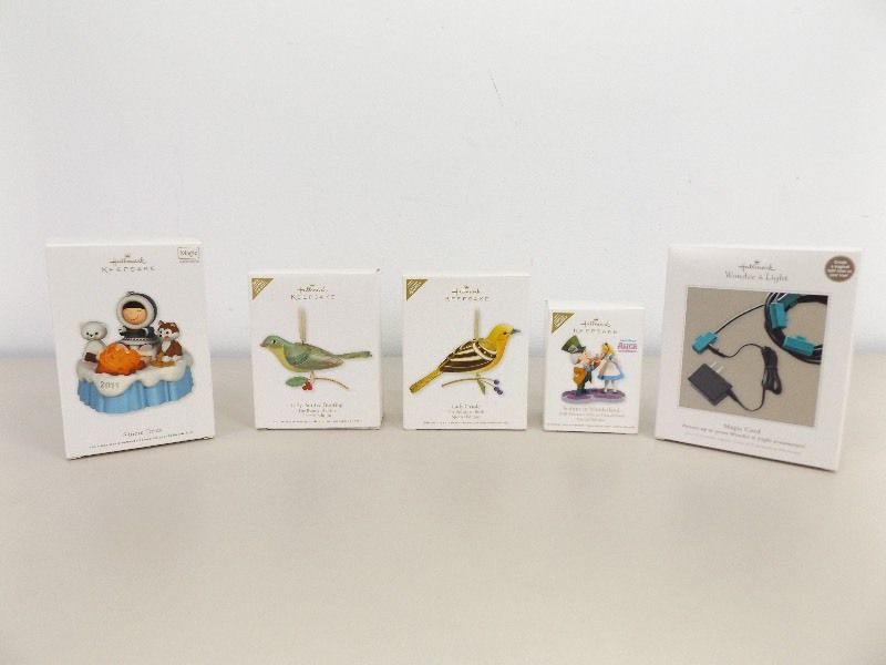 lot 24 image: 4 NEW Hallmark Keepsake Ornaments, and Hallmark Magic Cord